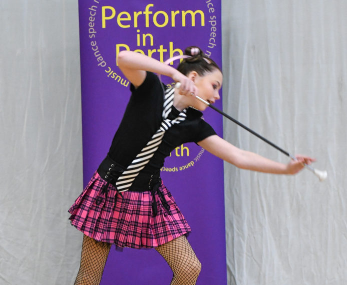 Performers show their sparkle as their batons twirl